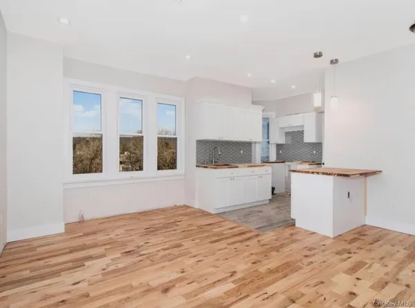 a view of kitchen and wooden floor
