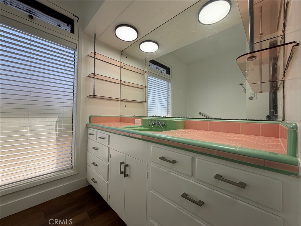 3590 Buchanan Street Riverside, CA 92503 - Photo 31 of 73 a bathroom with a sink and a mirror