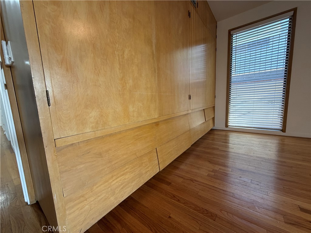 3590 Buchanan Street Riverside, CA 92503 - Photo 38 of 73 a view of an empty room with wooden floor and a window
