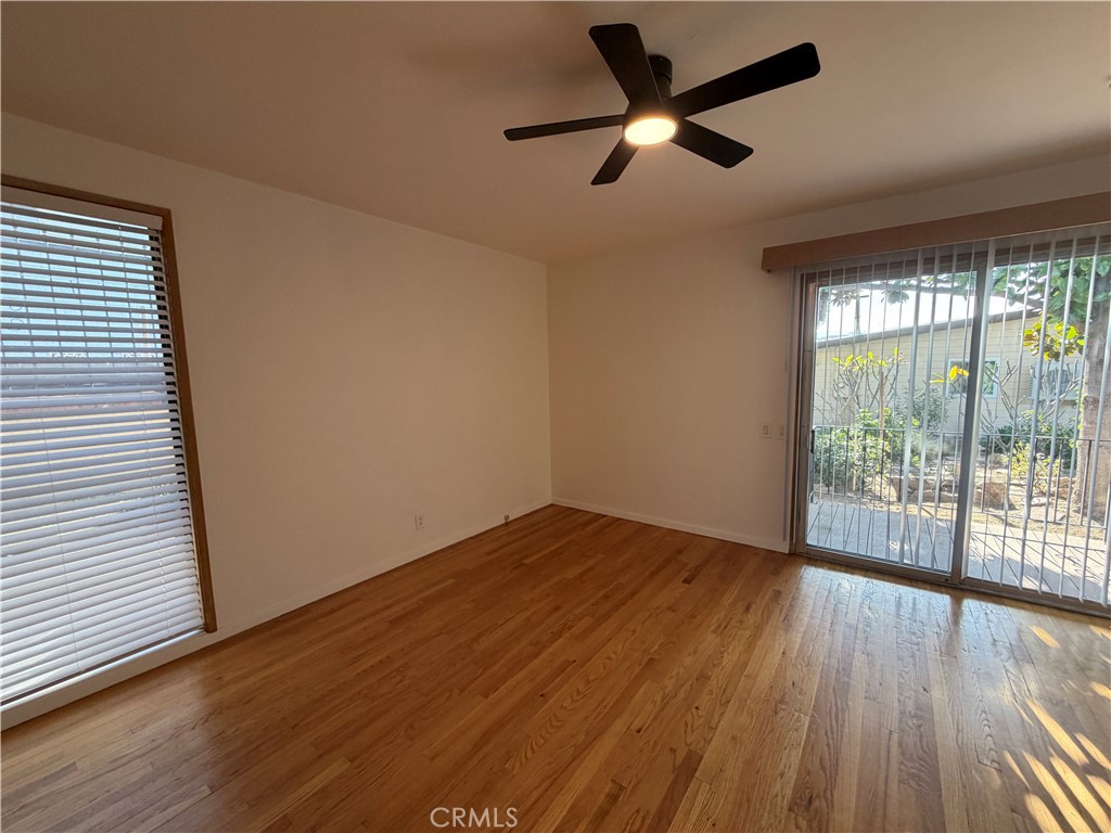 3590 Buchanan Street Riverside, CA 92503 - Photo 38 of 73 a view of empty room with wooden floor and fan
