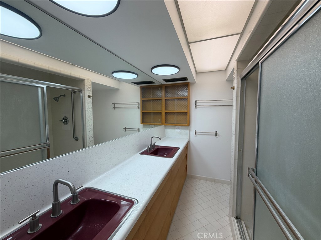 3590 Buchanan Street Riverside, CA 92503 - Photo 41 of 73 a bathroom with a sink and mirror