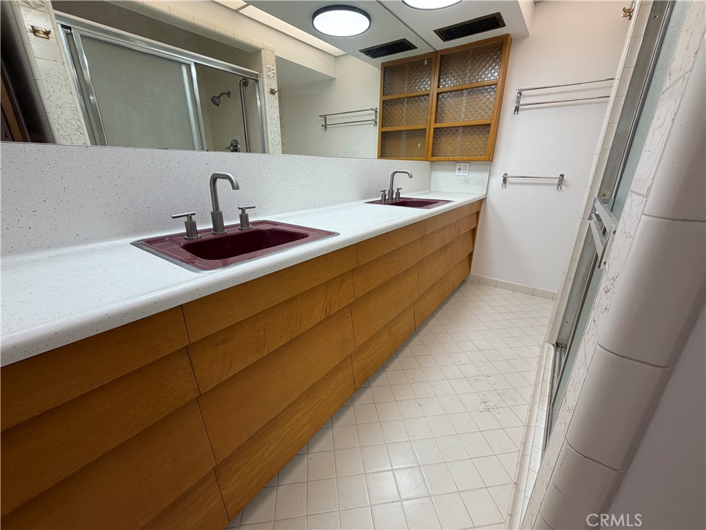 3590 Buchanan Street Riverside, CA 92503 - Photo 43 of 73 a bathroom with a sink and a mirror