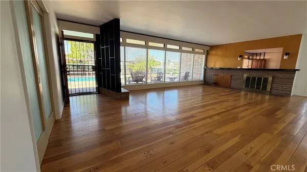 a kitchen with a sink and wooden cabinets