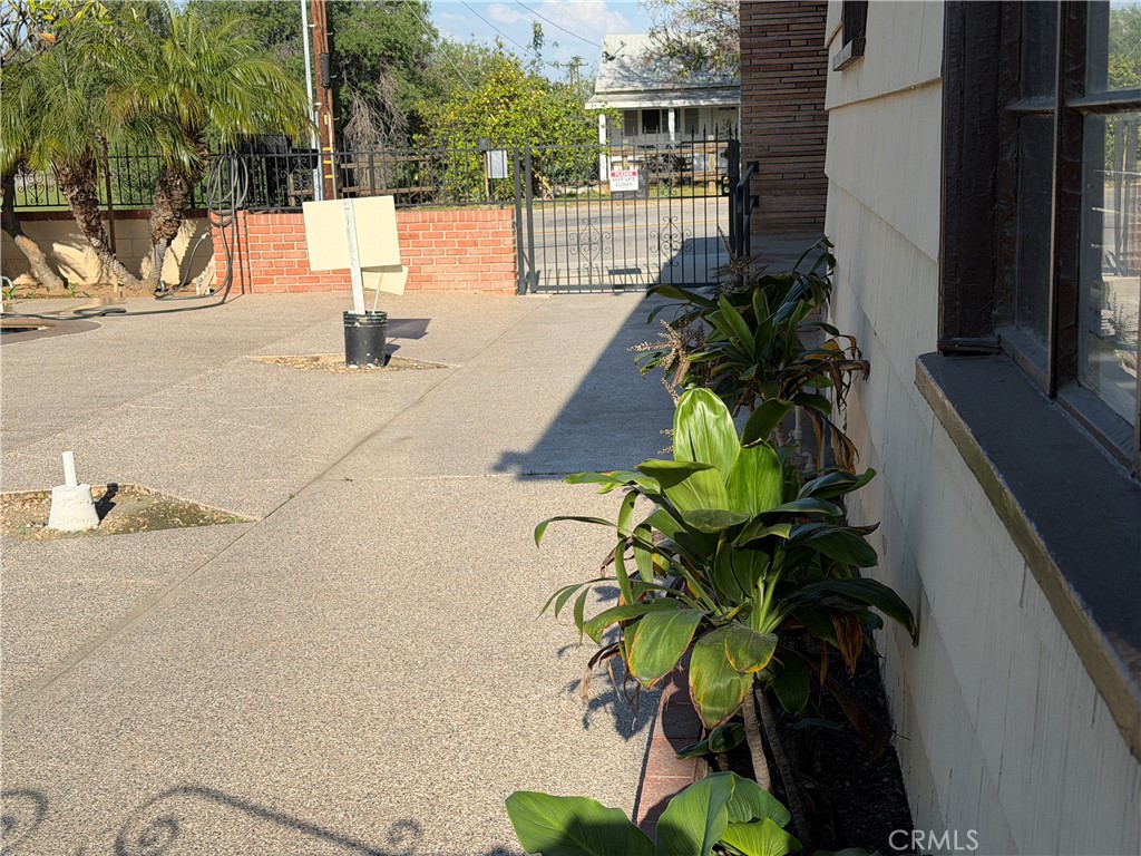 3590 Buchanan Street Riverside, CA 92503 - Photo 72 of 73 a vase of flowers sitting on a floor in front of a door