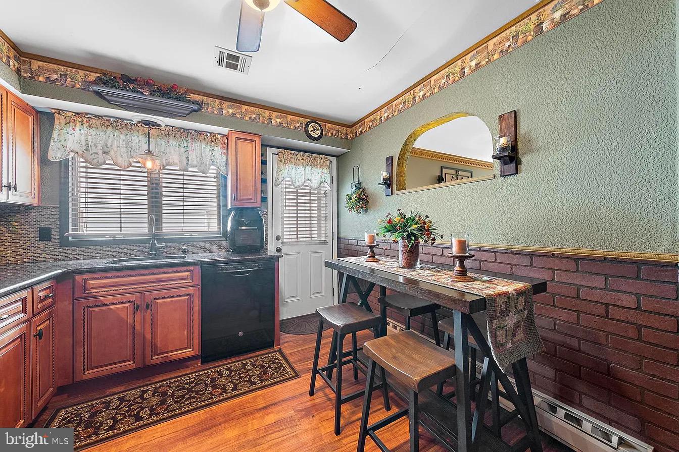 22 Fir Road Manahawkin, NJ 08050 - Photo 15 of 35 a kitchen with a table and chairs in it