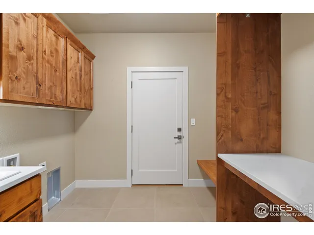 a open kitchen with cabinets wooden floor and stainless steel appliances
