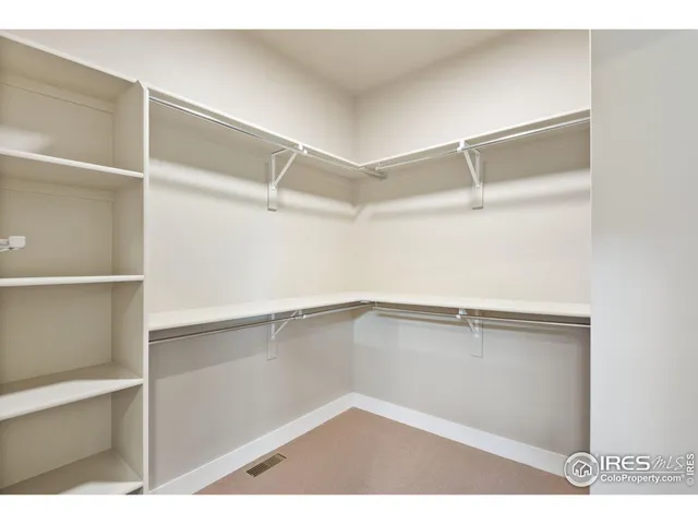 a bathroom with a granite countertop sink mirror and double