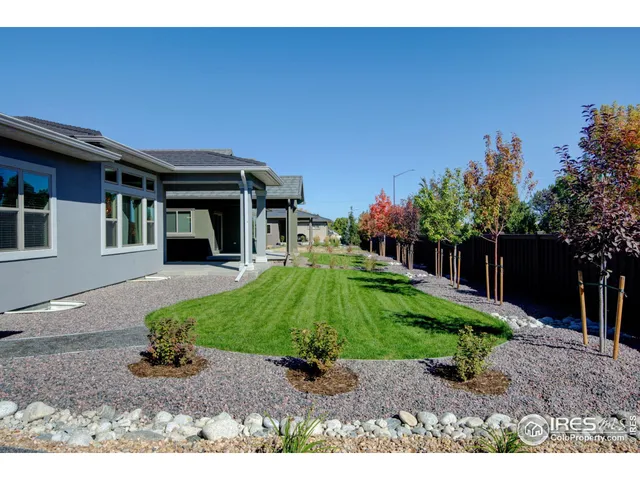 an aerial view of residential houses and outdoor space