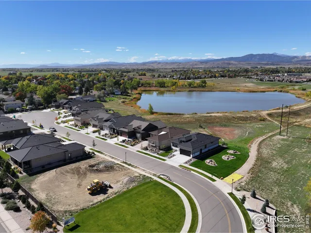 an aerial view of residential houses and outdoor space