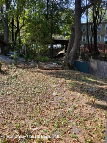 a view of a tree in front of a yard