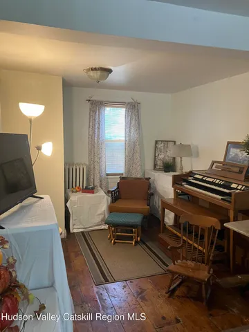 a bedroom with furniture and a lamp