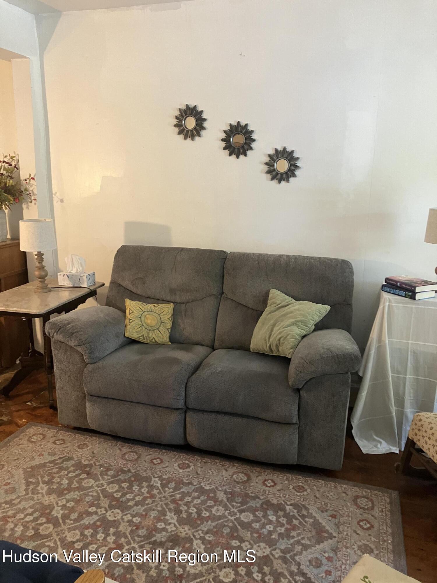 147 North Street Catskill, NY 12414 - Photo 7 of 23 a living room with furniture and a couch