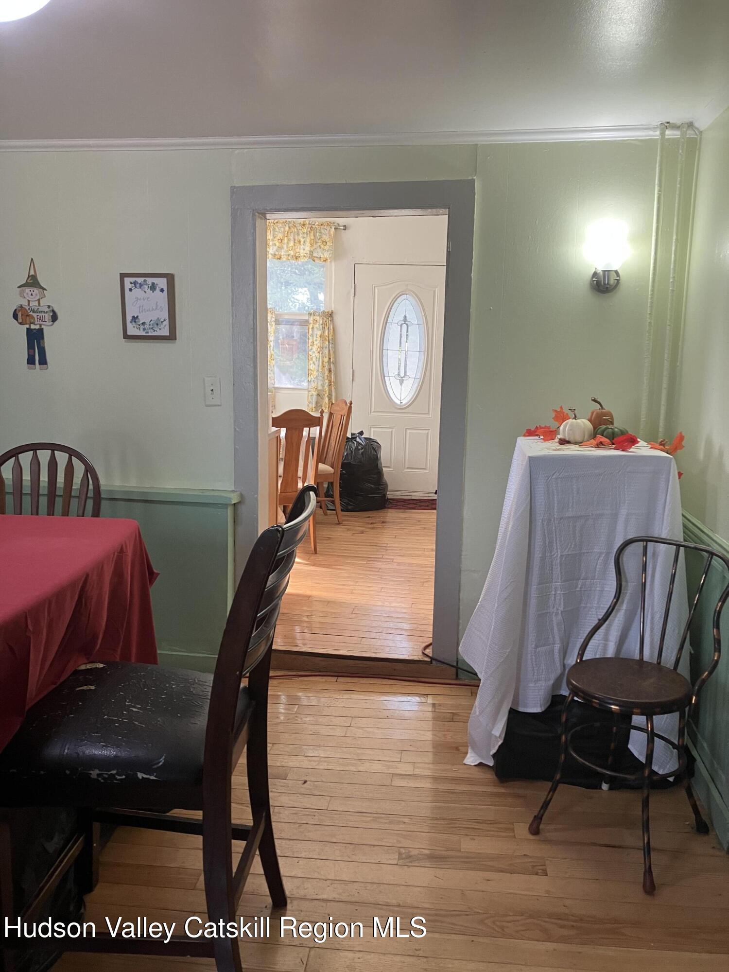 147 North Street Catskill, NY 12414 - Photo 9 of 23 a living room with furniture and a window