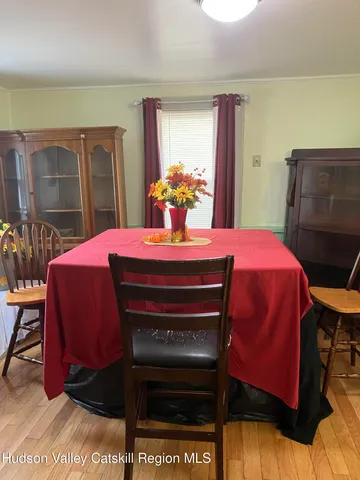 a bedroom with a bed and a table