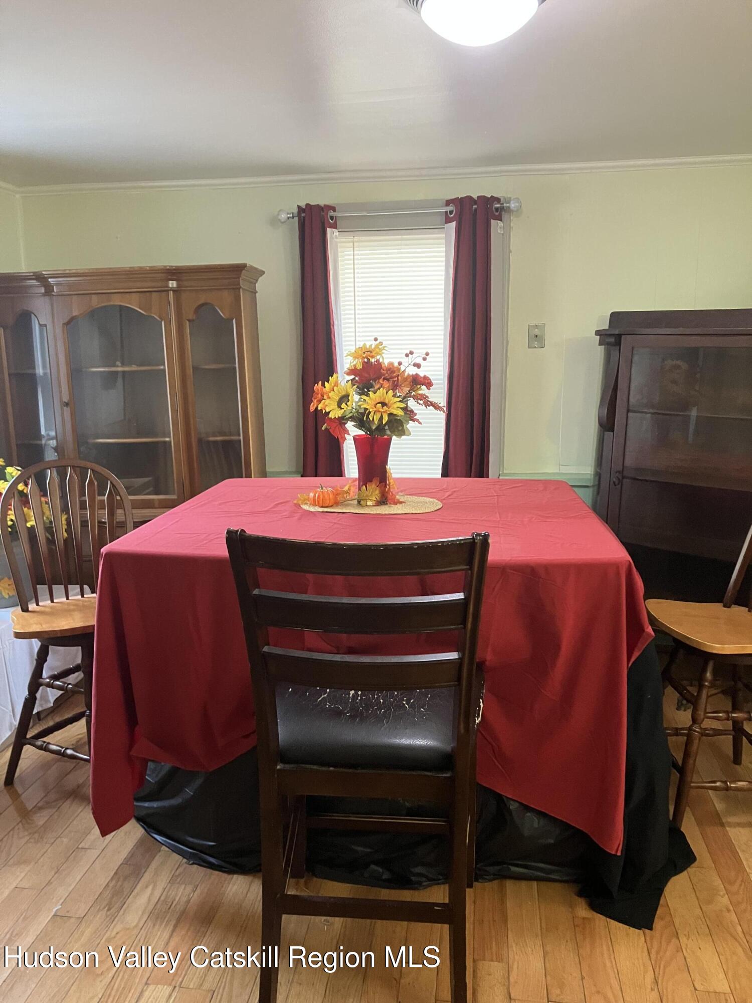 147 North Street Catskill, NY 12414 - Photo 10 of 23 a bedroom with a bed and a table