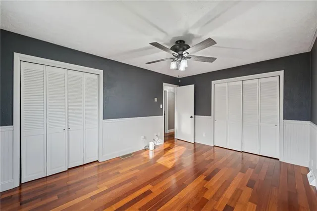 a view of a workspace with furniture and a bedroom