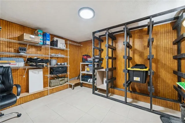 a living room with fireplace furniture and a flat screen tv