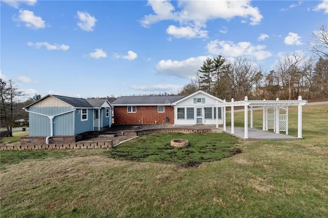 a view of a house with a yard