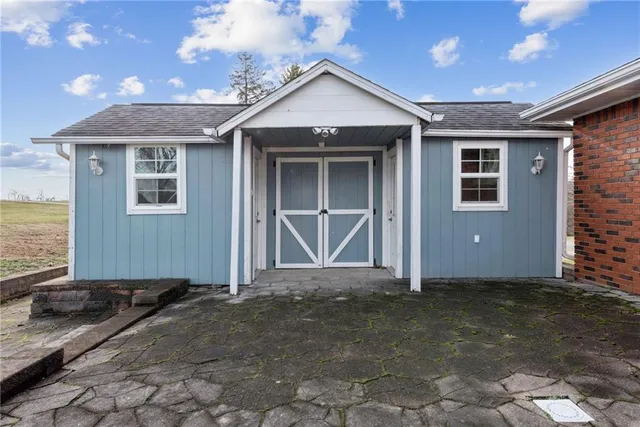 a view of a house with a big yard