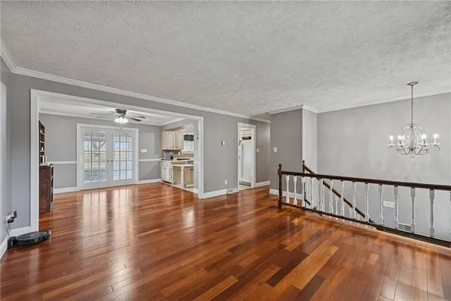 a large kitchen with stainless steel appliances a stove and a refrigerator