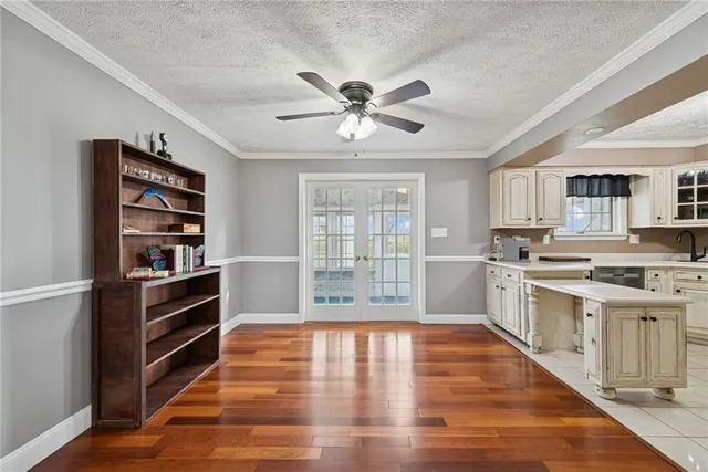 a kitchen with stainless steel appliances a stove refrigerator sink and cabinets