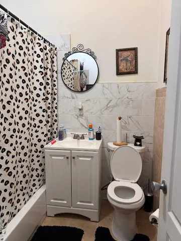a bathroom with a toilet and a sink