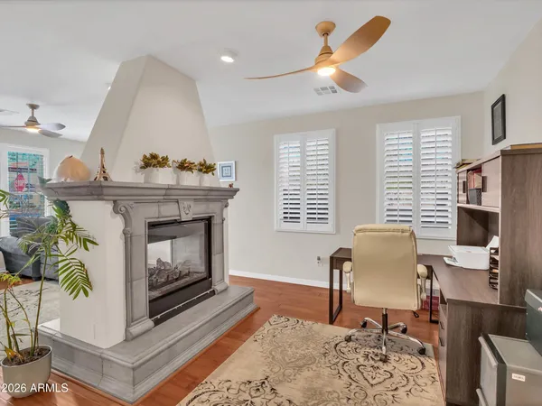 a living room with lots of furniture and a chandelier
