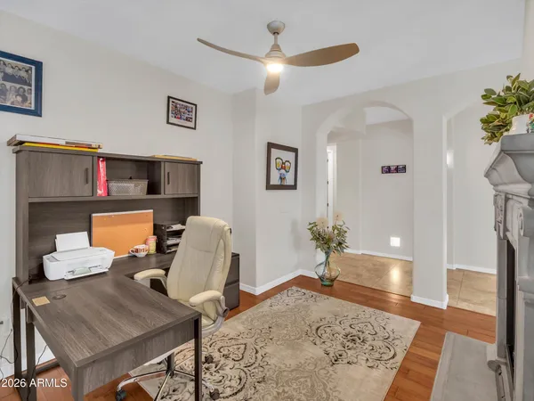 a kitchen with granite countertop a refrigerator stove top oven and sink