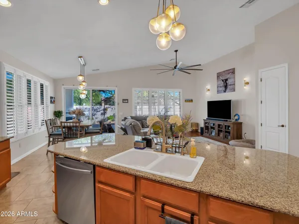 a view of a dining room with furniture and a chandelier