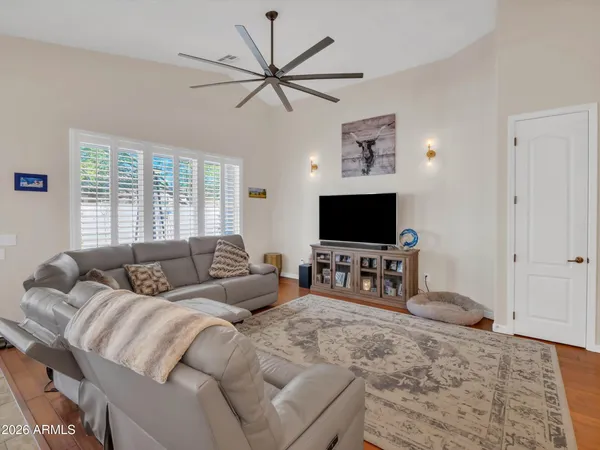a bedroom with furniture and flat screen tv