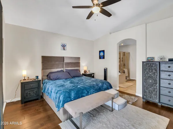a bathroom with a tub a double vanity sink and a large mirror