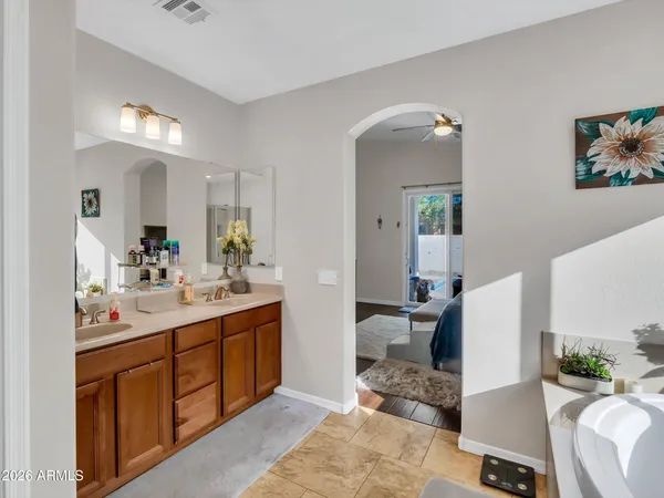 a view of walk in closet with clothes