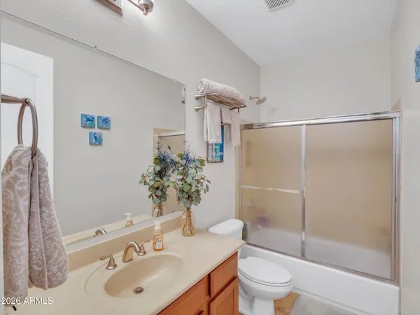 a balcony with furniture and a potted plant