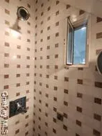 a bathroom with a shower and a sink