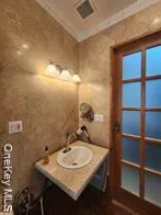 a kitchen with sink and cabinets