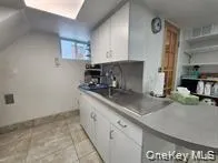 a bathroom with a shower a mirror and a shower