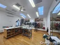 a view of hall way with furniture