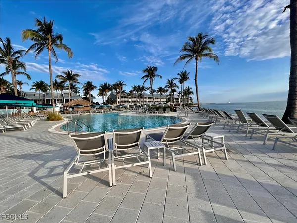 a view of a chairs and table in a patio