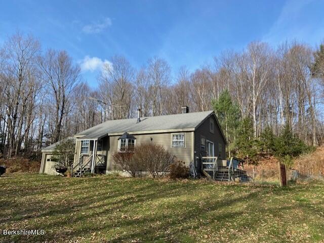 85 N Road Monroe, MA 01247 - Photo 1 of 11 a view of a house with a yard