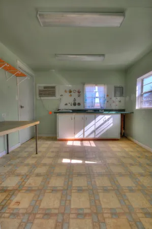 a view of a house with backyard and chair