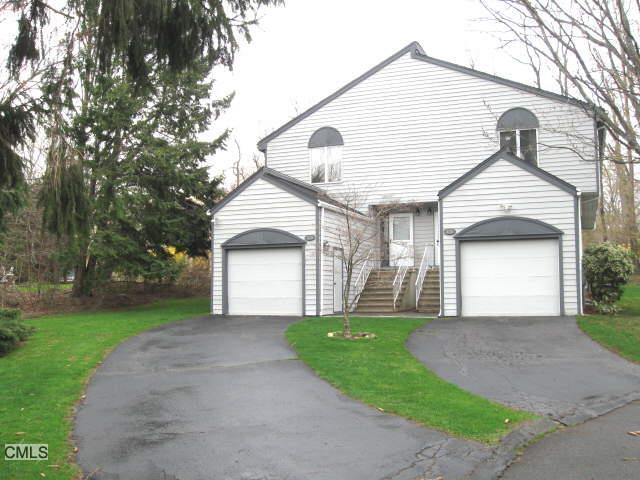 373 High Street Fairfield, CT 06824 - Photo 1 of 1 a front view of a house with a yard and garage