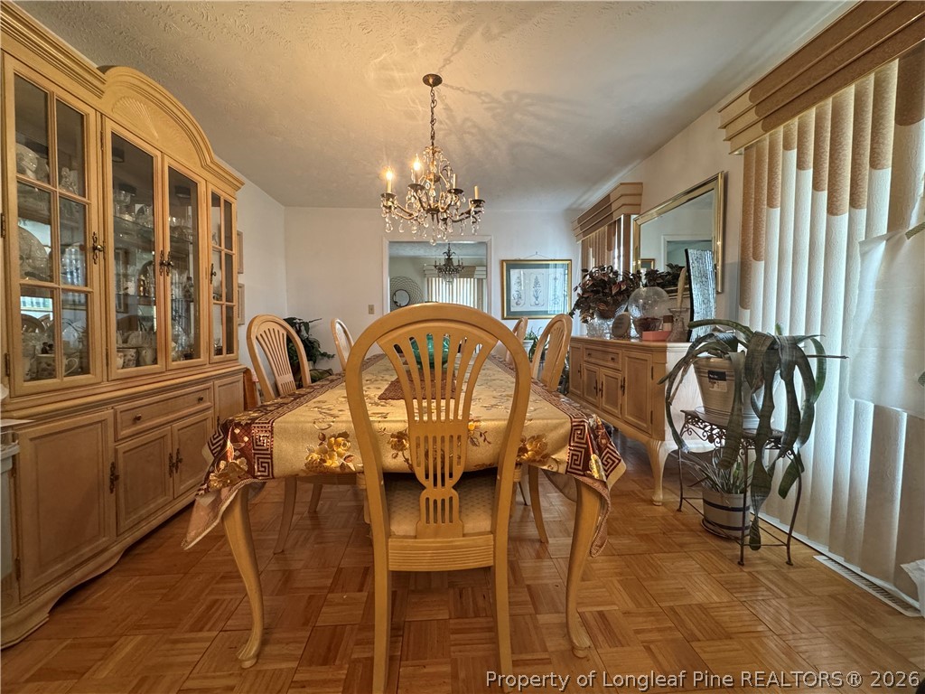 408 Old Farm Road Raeford, NC 28376 - Photo 11 of 27 a view of a dining room with furniture window and outside view