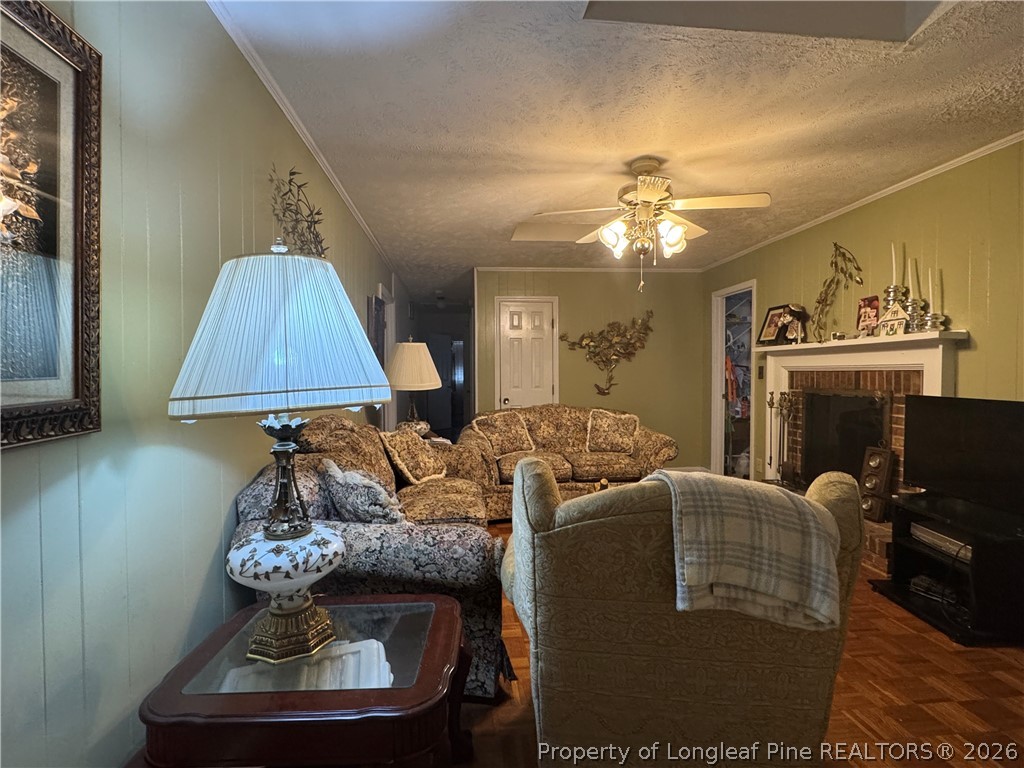 408 Old Farm Road Raeford, NC 28376 - Photo 16 of 27 a living room with furniture and a fireplace