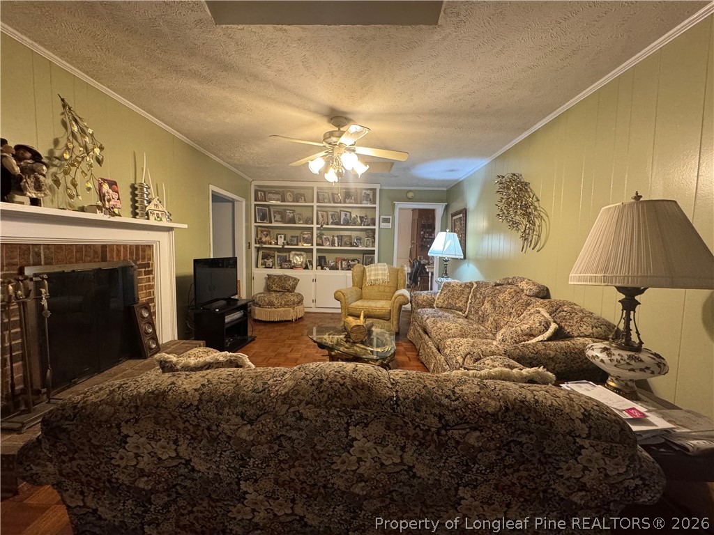408 Old Farm Road Raeford, NC 28376 - Photo 18 of 27 a bed room with a bed and a fireplace