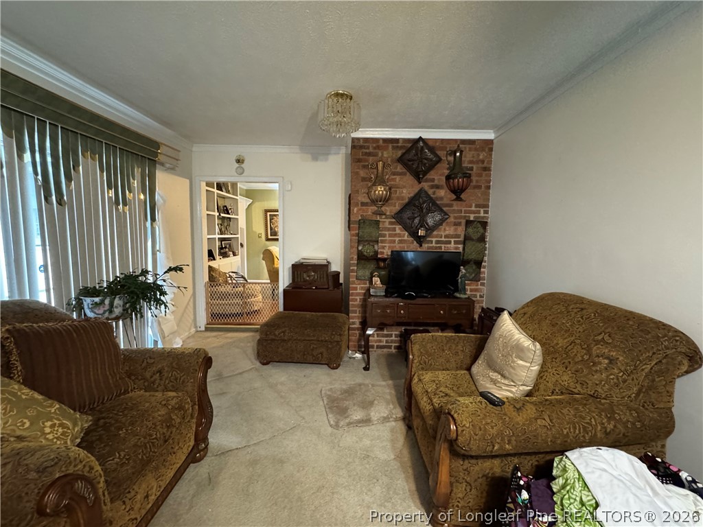 408 Old Farm Road Raeford, NC 28376 - Photo 20 of 27 a living room with furniture and a large window