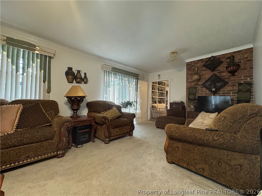 408 Old Farm Road Raeford, NC 28376 - Photo 21 of 27 a living room with furniture and a flat screen tv