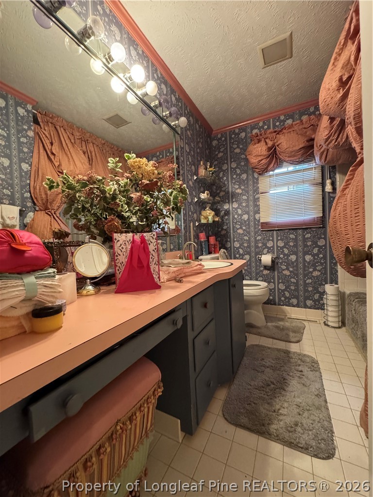 408 Old Farm Road Raeford, NC 28376 - Photo 23 of 27 a kitchen with stainless steel appliances granite countertop sink stove and cabinets