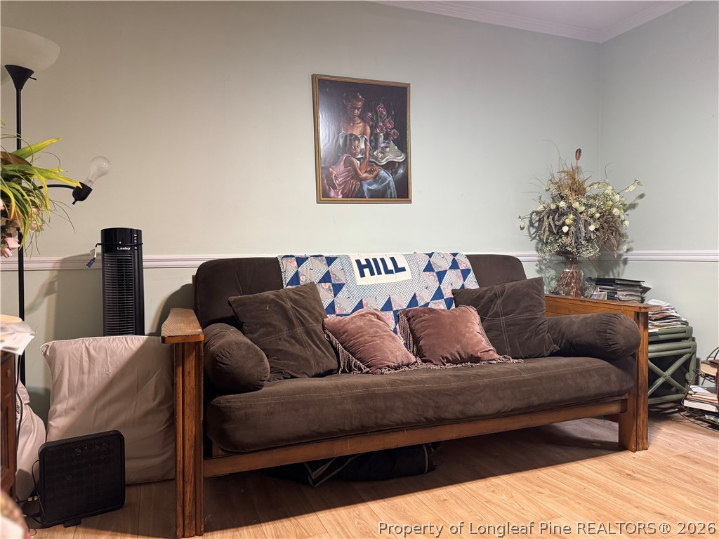 408 Old Farm Road Raeford, NC 28376 - Photo 27 of 27 a living room with furniture and a potted plant