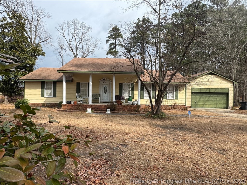 408 Old Farm Road Raeford, NC 28376 - Photo 3 of 27 a view of a house with yard and tree s