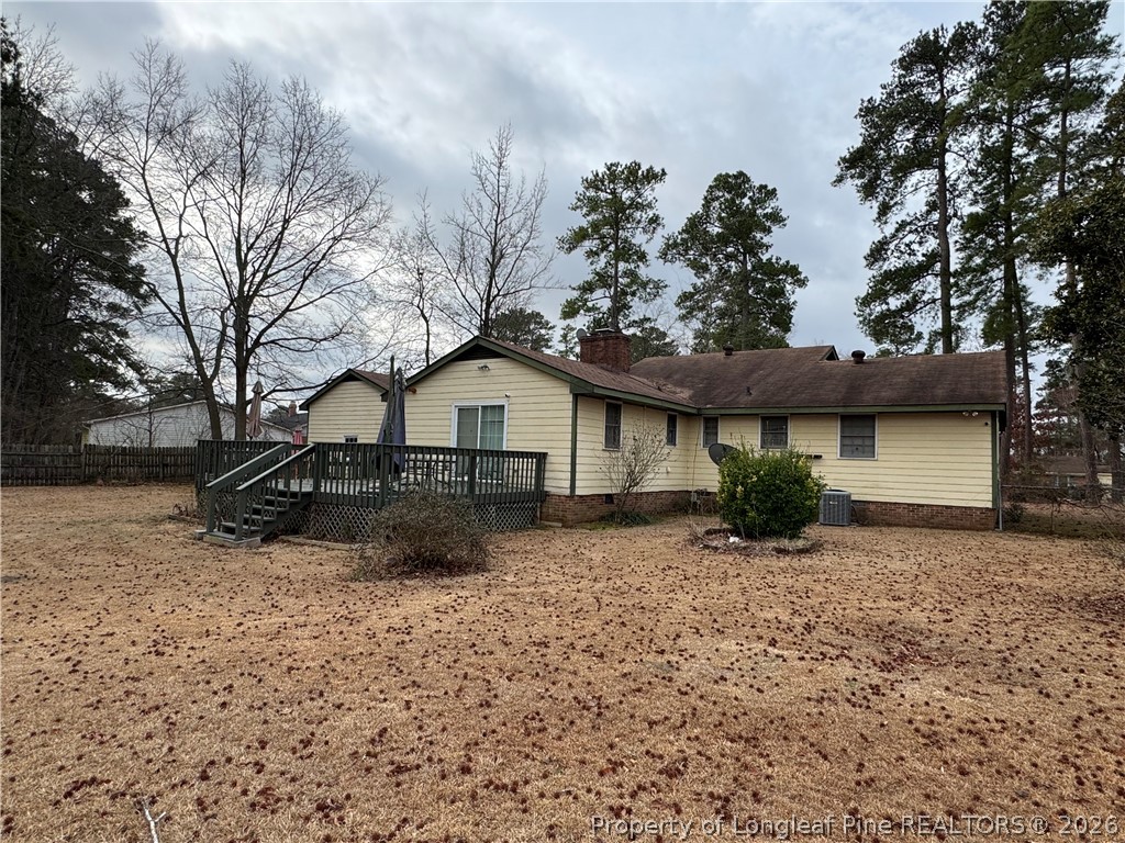 408 Old Farm Road Raeford, NC 28376 - Photo 5 of 27 a front view of a house with garden